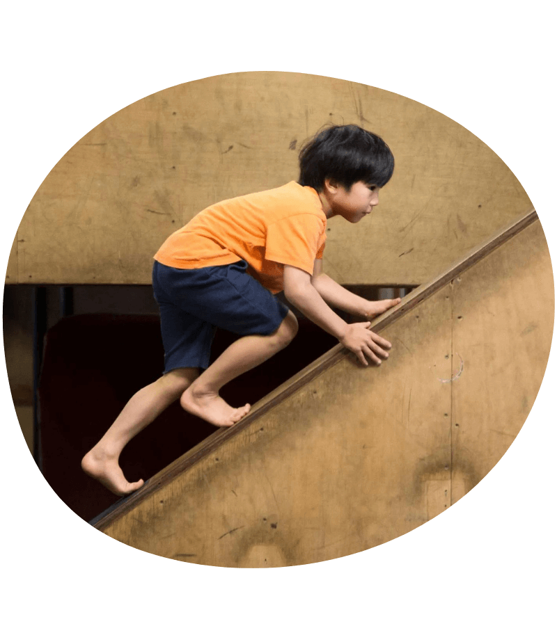 Kid learning to climb in an article by Kong Academy on responsible decision making.